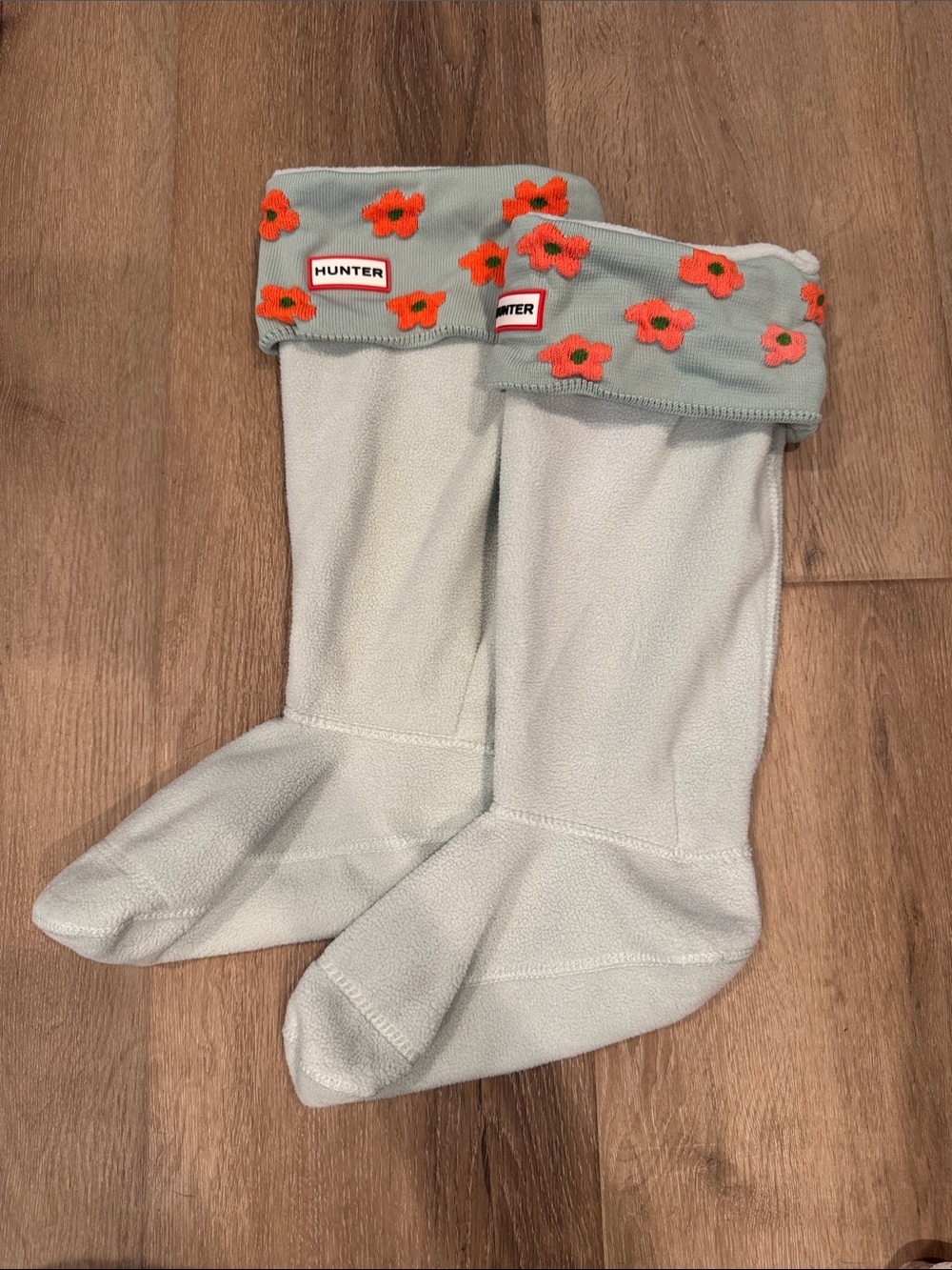 Hunter Tall light blue boot liners with orange floral cuffs